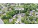 An aerial view showing a well maintained property with mature trees on a cul-de-sac at 9605 Mountain Ivy Ct, Charlotte, NC 28210
