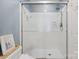 Bright bathroom featuring a glass shower, and white subway tile at 9605 Mountain Ivy Ct, Charlotte, NC 28210