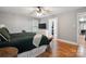 Comfortable bedroom featuring hardwood floors, closet, and natural light from the window at 9605 Mountain Ivy Ct, Charlotte, NC 28210