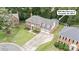 Beautiful brick two-story home featuring a manicured lawn, mature landscaping and a three car garage at 9605 Mountain Ivy Ct, Charlotte, NC 28210