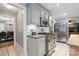 Kitchen features gray cabinets, a stainless steel stove and stainless steel refrigerator at 9605 Mountain Ivy Ct, Charlotte, NC 28210
