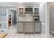 Kitchen with gray cabinets, display cabinets and a wine rack at 9605 Mountain Ivy Ct, Charlotte, NC 28210