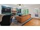 Living room featuring brick fireplace with mantle, and views of the yard at 9605 Mountain Ivy Ct, Charlotte, NC 28210