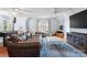 Spacious living room with comfortable seating, a foosball table, and hardwood floors at 9605 Mountain Ivy Ct, Charlotte, NC 28210
