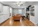 Living space featuring stainless steel refrigerator, wet bar, fireplace, and comfortable seating at 9605 Mountain Ivy Ct, Charlotte, NC 28210