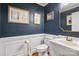 Charming powder room with custom millwork and a pedestal sink at 9605 Mountain Ivy Ct, Charlotte, NC 28210