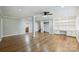 Finished basement with custom built-in storage and work space, a ceiling fan, and hardwood floors at 1008 Dumbarton Rd, Gastonia, NC 28054