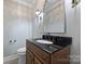 Charming bathroom features granite vanity and classic mirror at 1008 Dumbarton Rd, Gastonia, NC 28054