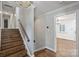 Hallway with wood floors and stairs, neutral paint, and white trim at 1008 Dumbarton Rd, Gastonia, NC 28054
