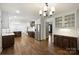 Bright kitchen with stainless appliances, marble countertops, hardwood floors, and a view to the next room at 1008 Dumbarton Rd, Gastonia, NC 28054