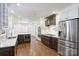 Open kitchen features marble countertops, stainless appliances, dual ovens, gas cooktop, and hardwood floors at 1008 Dumbarton Rd, Gastonia, NC 28054