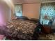 Cozy bedroom with dark patterned curtains and comfortable bedding at 1064 Calico Farm Ct, Cleveland, NC 27013