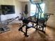 Spacious exercise room featuring fitness equipment, TV, and natural light, perfect for home workouts at 1064 Calico Farm Ct, Cleveland, NC 27013