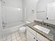 Bathroom featuring granite countertops, neutral flooring, and a shower/tub combination at 11103 Fox Cove Dr, Charlotte, NC 28273