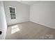 Cozy bedroom with soft carpeting, natural light, and a neutral color scheme at 11103 Fox Cove Dr, Charlotte, NC 28273