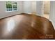 Bedroom features a window with backyard view and hardwood flooring at 11103 Fox Cove Dr, Charlotte, NC 28273
