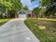 Charming home with gray siding, a brick facade, and an attached two-car garage at 11103 Fox Cove Dr, Charlotte, NC 28273