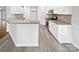 Well-lit kitchen featuring granite countertops, stainless steel appliances, and ample cabinet space at 11103 Fox Cove Dr, Charlotte, NC 28273