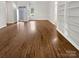 Open-concept living space with hardwood floors, ample natural light, and built-in shelving at 11103 Fox Cove Dr, Charlotte, NC 28273