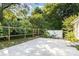 Concrete patio area with a partial fence and backyard at 11411 Ridge Oak Dr, Charlotte, NC 28273