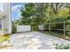 Outdoor concrete patio area with backyard shed and a partial fence at 11411 Ridge Oak Dr, Charlotte, NC 28273