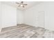 Spacious bedroom with a ceiling fan and two doors at 11411 Ridge Oak Dr, Charlotte, NC 28273