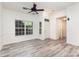 Bright living room with modern flooring and an entrance to the home's foyer at 11411 Ridge Oak Dr, Charlotte, NC 28273