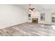 Spacious living room featuring a brick fireplace, modern floors, and ample natural light at 11411 Ridge Oak Dr, Charlotte, NC 28273
