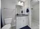 Bathroom featuring a single vanity, neutral walls and flooring, a toilet, and a walk-in closet at 1169 Hollis Sw Cir, Concord, NC 28025