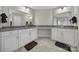 Elegant bathroom with dual sinks, granite countertops, and ample cabinet space at 1169 Hollis Sw Cir, Concord, NC 28025