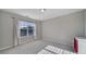 Well-lit bedroom with a large window, neutral walls and carpet, and white trim at 1169 Hollis Sw Cir, Concord, NC 28025