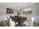 Elegant dining room featuring modern chandelier and painting, perfect for entertaining guests at 1169 Hollis Sw Cir, Concord, NC 28025