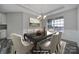 Dining room with modern chandelier, painting, and large window, perfect for entertaining guests at 1169 Hollis Sw Cir, Concord, NC 28025