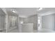 Hallway featuring neutral-colored walls and carpet, white trim, and doors leading to various rooms at 1169 Hollis Sw Cir, Concord, NC 28025