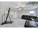 Spacious living room with a leather sectional sofa, neutral walls, and ceiling fan for comfortable living at 1169 Hollis Sw Cir, Concord, NC 28025