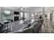 Inviting living room and fireplace with open flow to a modern kitchen with white cabinetry at 1169 Hollis Sw Cir, Concord, NC 28025