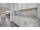 Wet bar with granite countertops, perfect for preparing cocktails and drinks at 1169 Hollis Sw Cir, Concord, NC 28025
