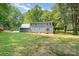 Exterior view of a blue house featuring a well-maintained lawn and mature trees at 133 Pecan Ln, Salisbury, NC 28146