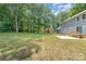 Exterior view of a blue house featuring a well-maintained lawn and mature trees at 133 Pecan Ln, Salisbury, NC 28146