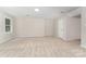 Spacious finished basement with neutral carpet and a large window at 133 Pecan Ln, Salisbury, NC 28146