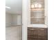 Bathroom featuring a modern vanity with decorative wood paneling and stylish lighting at 133 Pecan Ln, Salisbury, NC 28146