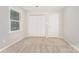 Light-filled bedroom features neutral walls, carpeted floors, and a closet for storage at 133 Pecan Ln, Salisbury, NC 28146