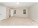 Bright bedroom featuring neutral walls, carpeted floors, and windows that provide natural light at 133 Pecan Ln, Salisbury, NC 28146