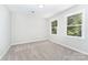 This bedroom offers a bright, neutral space with carpet flooring and windows for natural lighting at 133 Pecan Ln, Salisbury, NC 28146
