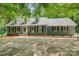Charming home with a well-manicured lawn, complemented by mature trees and a welcoming facade at 133 Pecan Ln, Salisbury, NC 28146
