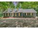 Charming home with a well-manicured lawn, complemented by mature trees and a welcoming facade at 133 Pecan Ln, Salisbury, NC 28146