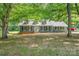 Inviting home featuring mature trees, providing ample shade and enhancing its curb appeal at 133 Pecan Ln, Salisbury, NC 28146