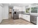 Modern kitchen with stainless appliances, granite countertops, and white cabinets is spacious and updated at 133 Pecan Ln, Salisbury, NC 28146