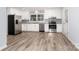 A modern kitchen features stainless steel appliances, granite countertops, and white cabinets at 133 Pecan Ln, Salisbury, NC 28146