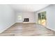 Open living space with fireplace, and sliding glass doors leading to a deck at 133 Pecan Ln, Salisbury, NC 28146